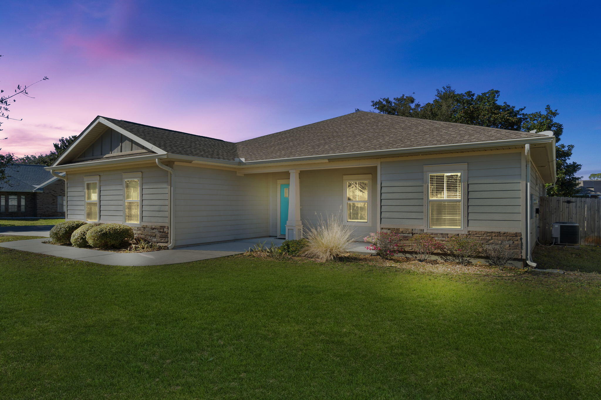 Looking for a NEWER build with coastal charm? This is it! Situated on a corner lot at the end of a no-outlet street, this single-level home offers community access to the Santa Rosa Sound, so you can launch a kayak or watch the sunset right from your neighborhood. The inside living space is elevated with custom touches like tray ceilings, transom window accents, rich LVP floors, and crown molding. Split floorplan and BRAND NEW carpet in the bedrooms. A well-appointed kitchen is ready for gathering with dark wood cabinetry, SS appliances, and granite countertops. Outside, sprinkler system and gutters already installed. Want a pool? There's more than enough room to build it in the fenced backyard. Easy access to retail, dining, military bases, and Navarre beaches! No HOA. Come see!
