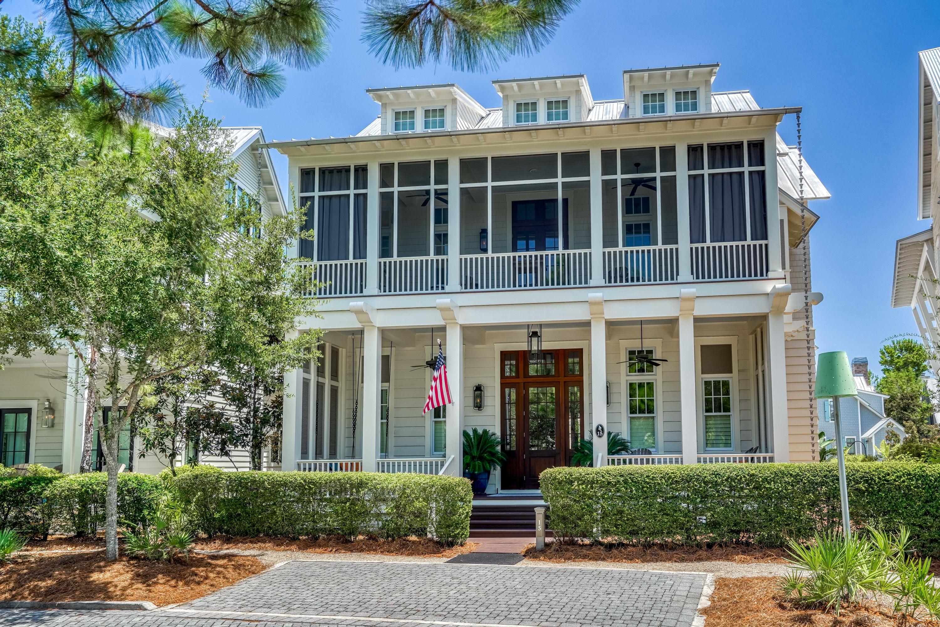 A home with a story to tell in each room, this WaterColor masterpiece stuns from the moment you walk through the front door. Every detail has been meticulously curated resulting in a true artisan space that feels like a historic home yet with every modern convenience imaginable. A 4BR main home and 1BR carriage home with a bunk room share a bricked courtyard and a covered outdoor living area with TV and wet bar. Inside, reclaimed wood and beams, salvaged brick, iron accents and custom lighting by Eloise Pickard create a warm and welcoming rustic atmosphere. The open concept living and dining area is anchored by a showpiece brick fireplace with custom shuttered cabinets. A highlight of the dining room is the stunning chandelier created from an antique hay rake wheel. The stories continue...