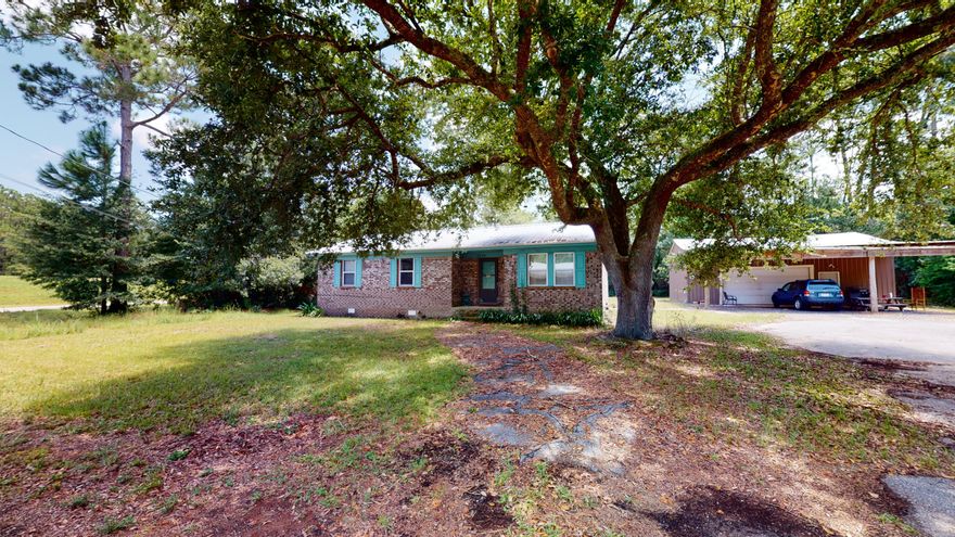 **Click on link to view virtual tour!!***FULLY FURNISHED ranch style home is on a double lot in the Avalon Beach area and only a short distance from I10, Pensacola and the beaches, and when headed in the other direction, you are close to Whiting Field and plenty of Milton/Pace shopping and dining. This is a great 3 bed/2bath with some upgrades including a newer metal roof and vinyl clad windows.  Updated vinyl plank flooring throughout.  Bathrooms have newer vanities and the master bath has custom ship lap walls.   The kitchen and dining area are open to the living area, creating an open floor plan. The laundry room is located inside. Call today to schedule your showing. This is in an AE Flood zone.  All personal items, including items in the workshop, will be removed prior to closing.