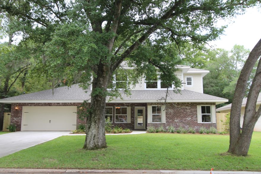 The 4/4 home, which is built to Earth Cents energy standards, is perfect for a large family. Location, location, location. As you enter the front of the home through the large covered porch, you will enter the foyer and the living room is on your right. Bedroom one is tucked away on your left. As you continue down the hallway, the kitchen is on your right and the dining room is on your left. The kitchen boasts custom cabinetry with crown moulding and plant ledges, 3 CM. Granite countertops, Frigidaire Gallery series stainless appliances {including a commercial grade refrigerator/ freezer),and roomy breakfast bar. The greatroom is located at the rear of the home and opens to a large patio which is perfect for entertaining. The master suite is located the right, rear, of the home and has 2 large walk - in closets, double vanities, whirlpool bath with separate shower with glass enclosure and a linen closet. The upstairs 2 roomy bedrooms each with separate full baths and walk in closets. Home has a Taexx ,''in the wall'', pest control system that is serviced from the exterior of the home, for owner's convenience. Yard is fully fenced and boasts mature trees. The yard is beautifully landscaped and come complete with a sprinkler system, well, pump and timer.