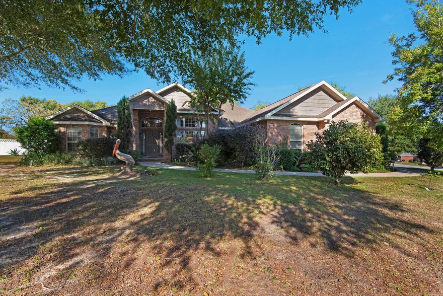This beautiful, energy-efficient home sits inside the sought after Lake Victoria waterfront community in Crestview. This home is zoned for the top performing schools in Okaloosa County. It sits on a gorgeous shady corner lot lined with huge majestic trees and graceful azaleas. The all brick exterior home offers a side entry garage, privacy fenced back yard, The interior boasts a gas fireplaces, custom window treatments throughout, and architectural features that include vaulted ceilings. This well-constructed, solidly built home qualifies for valuable homeowner's insurance credits for upgraded hurricane building code items (windstorm mitigation certification, 30 year architectural roof construction,