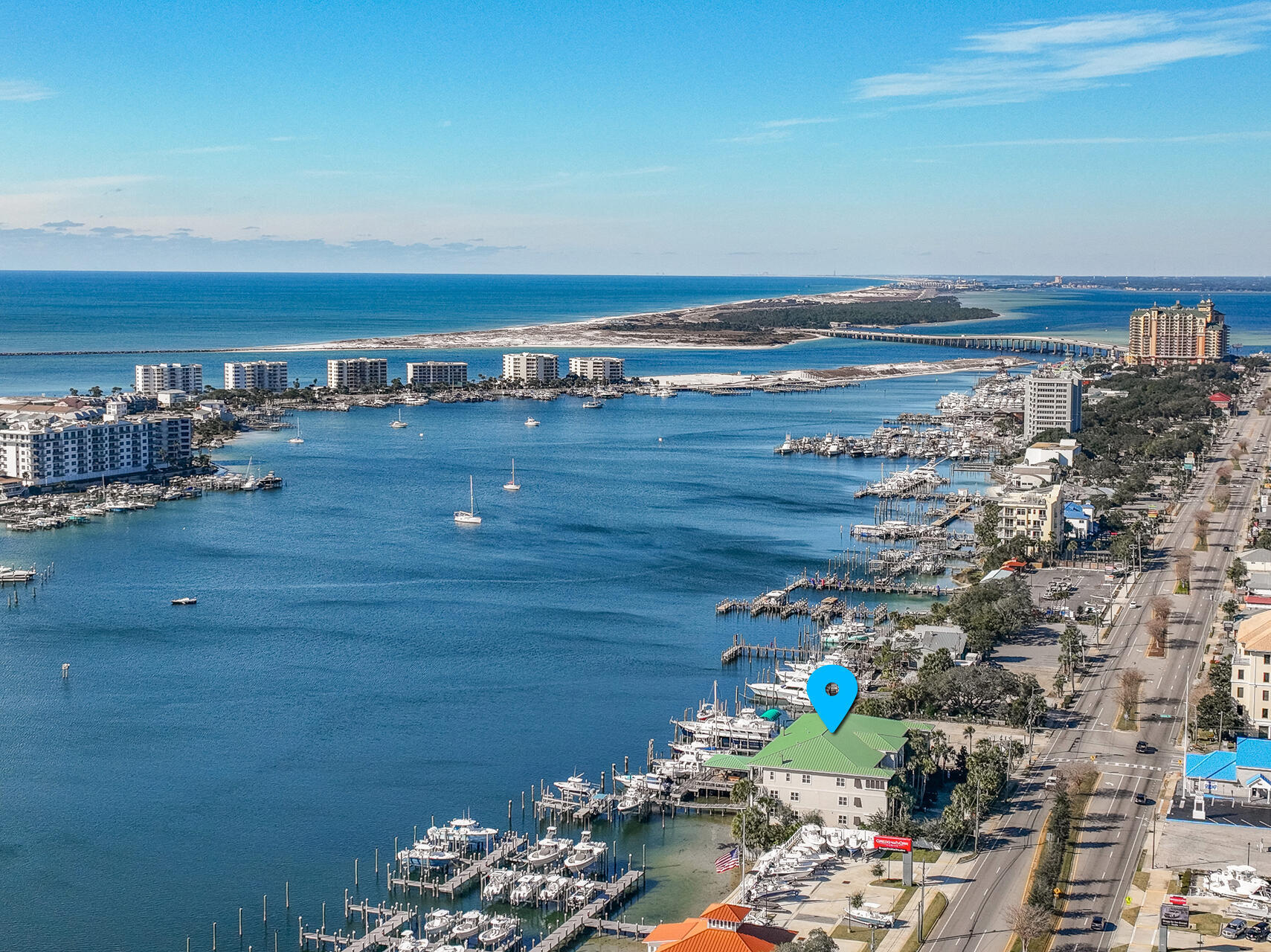 The ultimate haven for boating enthusiasts! This elegantly designed three-bedroom condo perched on a bluff overlooking the Destin Harbor combines luxury, serenity, and functionalityThis condo comes with a deeded slip featuring a recently installed 20,000lb boat lift, a custom-built large cleaning table, and the ability to accommodate a 36' to 40' boat--one of the few properties on the Destin Harbor with such a capability. Equipped with a full electrical pedestal, water hookup, and a remote control to operate the lift from inside your boat. From the moment you step inside, you're greeted by breathtaking harbor views that flow seamlessly into an open floor plan, bathing the space in natural light through corner windows facing east and south. The timeless design features raised tray ceilings, crown molding, and travertine flooring throughout, creating an ambiance of refined coastal charm.
The master suite is a sanctuary in itself, offering panoramic harbor views, private balcony access, a spacious walk-in closet, and a spa-like master bath complete with a whirlpool tub, separate shower, and travertine finishes.
The chef's kitchen is a masterpiece with granite countertops, stainless steel appliances, and upgraded lightingperfect for entertaining or quiet evenings at home.
Step outside to enjoy resort-style amenities, including a harbor-front pool, a luxurious cabana perched over the water, and a private boat slip equipped with the new 20,000lb boat lift. With deep-water access and underground parking, this property is as practical as it is stunning.

This condo offers not just a home but a lifestyleelegance, functionality, and the unparalleled beauty of the Destin Harbor. A true dream for boaters and visionaries alike.