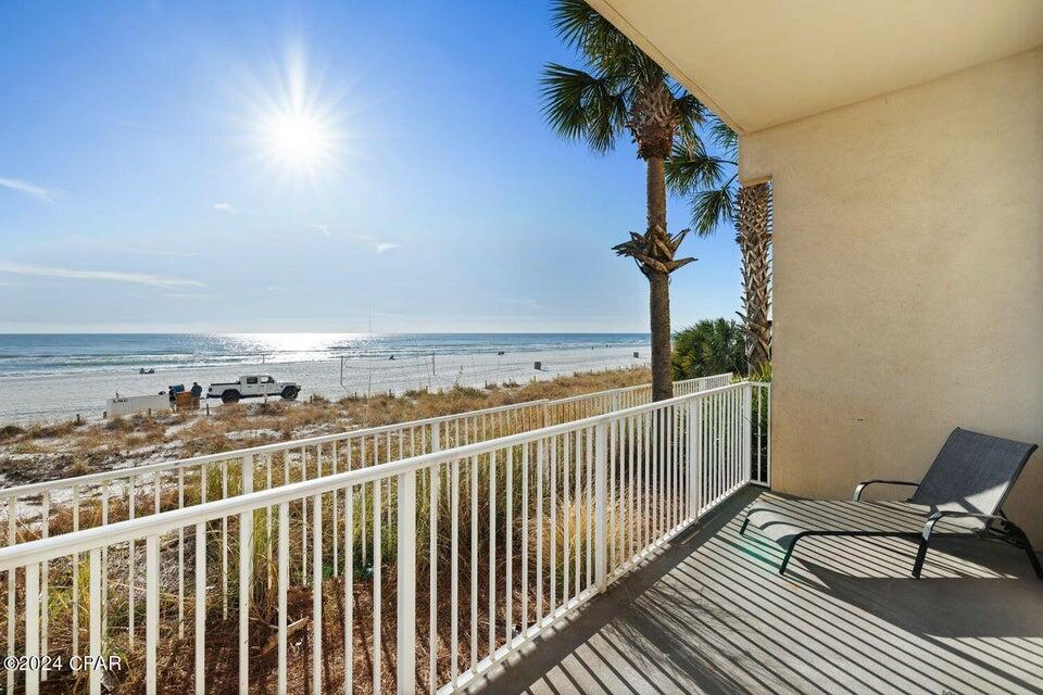 Gulf front ground floor with fantastic views! Walk out your front door and walk right over to the pool, hot tub & tiki bar! So easy and convenient to enjoy the grand resort amenities at The Shores. No elevator wait here!. This 1 bedroom, 2 bath condo includes a bunk nook for the kids! This highly desirable ''I'' floorplan has a gulf front living/dining area, beautiful upgraded kitchen with QUARTZ counter tops, porcelain plank wood grain tile throughout the entire condo and it is being sold fully furnished and rental ready. The Shores of Panama is a tropical resort with amenities including a multi-million dollar 13,966 sq ft gulf front lagoon pool and a gulf front oversized hot tub, beautiful fountains and waterfalls, 2 tiki bars, and exotic tropical landscaping. Amenities also include a large indoor heated pool, indoor hot tub, on site full service spa with sauna and steam rooms, and covered parking. One assigned parking space conveys with this condo. Come view this beauty today!