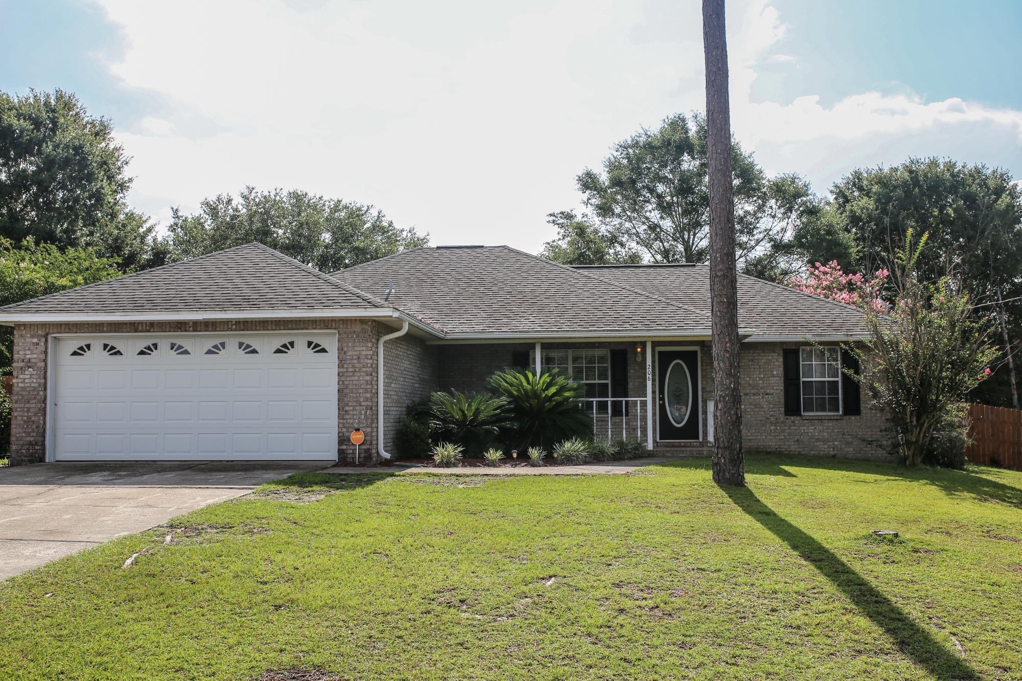Situated on a corner lot, south of I-10 within minutes of Eglin and 7th Group, this 3/2 split floor plan home is an entertainer's paradise! Upon entering, you are greeted by a spacious living room with vaulted ceilings and a beautiful, brick fireplace. The kitchen features wood laminate flooring, stainless steel appliances, and an elegant formal dining area. The master bedroom features a private entrance to the Florida room and a large bathroom with a make-up vanity, soaking tub, separate shower, and expansive walk-in closet. The Florida room is completely surrounded by windows overlooking the large composite outdoor deck and flat, fully fenced backyard. The garage offers upgraded epoxy flooring. Roof replaced 2005. ONE YEAR WARRANTY PROVIDED! Buyer to verify all facts deemed important