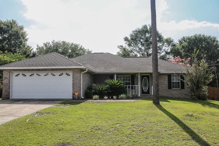 Situated on a corner lot, south of I-10 within minutes of Eglin and 7th Group, this 3/2 split floor plan home is an entertainer's paradise! Upon entering, you are greeted by a spacious living room with vaulted ceilings and a beautiful, brick fireplace. The kitchen features wood laminate flooring, stainless steel appliances, and an elegant formal dining area. The master bedroom features a private entrance to the Florida room and a large bathroom with a make-up vanity, soaking tub, separate shower, and expansive walk-in closet. The Florida room is completely surrounded by windows overlooking the large composite outdoor deck and flat, fully fenced backyard. The garage offers upgraded epoxy flooring. Roof replaced 2005. ONE YEAR WARRANTY PROVIDED! Buyer to verify all facts deemed important