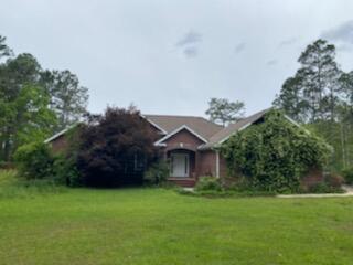 Investor Special. 1 acre waterfront property on Meadow Lake. House needs work, most everything is original from when built.