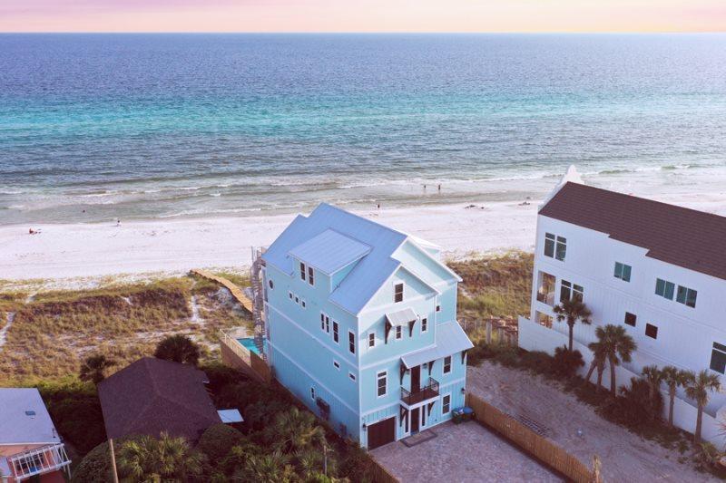 The House is now complete and already on rental. Rental projections over 400K. Unbelievable Beach House, largest one Built on Panama City Beach and on the highest elevations of any lot on the beach. This house has it all, over 5964 square foot of Conditioned Air with 9 bedrooms, 9.5 baths, Two Living Rooms, Two Kitchens, Rec Room and over 1700 square foot of Decks on 4 levels with a 37' pool with a swim up bar over looking the Gulf from a 30' Cliff. Garage and enough parking space for 7 cars. Totally designed for the large family retreat or a fantastic Rental Beach House that will sleep 30. Total finished with furniture expected on 6/8/2019 and will be ready to go just in time for the Summer of 2019.