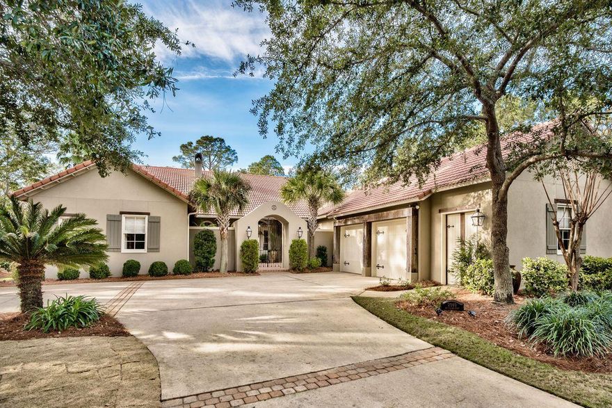 A versatile lifestyle is at the forefront of this bespoke home in Burnt Pine, with single-level living, a sizable yard and pleasant entertaining spaces offering numerous possibilities. Tucked away on a large, private lot, this home was inspired by A. Hayes Town and boasts his trademarks throughout with classic European features and French Creole influence. Lounge by the large pool or take in views of the lake with water feature from the covered porch. Entertain in a well-appointed kitchen with granite countertops, island with prep sink, walk-in pantry, Wolf stove with double ovens, Sub-Zero refrigerator, ice maker and more. Welcome guests to a comfortable great room with floor-to-ceiling custom cabinets beneath a lofty cathedral ceiling.