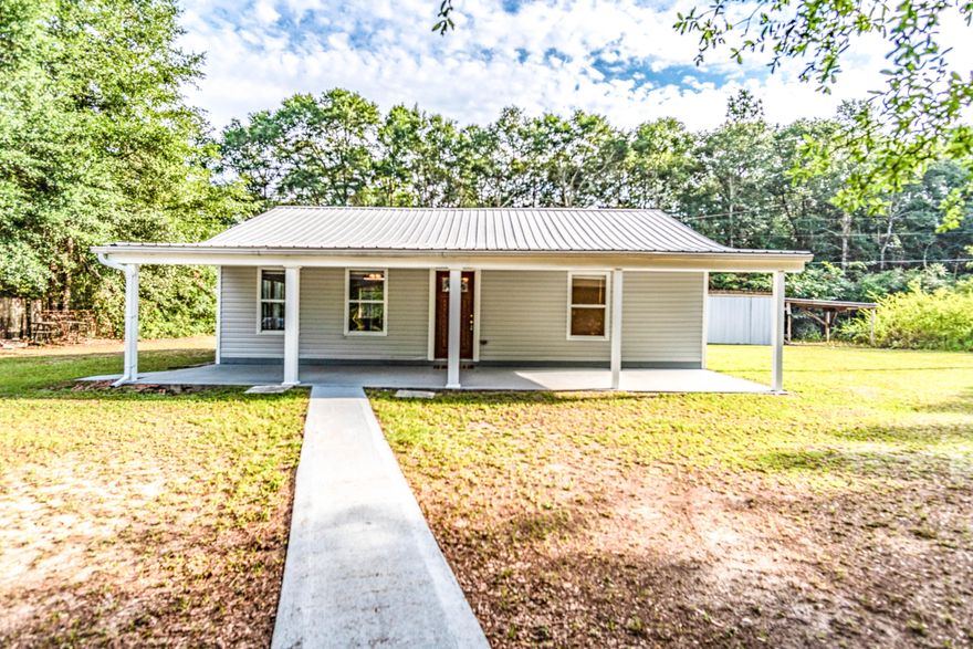 Here is your ''Rare Find'' opportunity to own a completely remodeled and upgraded 2/1 home in Holt convenient to Eglin AFB/7th Group/Duke field as well as Milton/Pensacola. This home features an welcoming oversized front porch with an open concept living room/kitchen perfect for entertaining. The kitchen is a chef's delight with ample counter space and cabinets with a large center island with extra sink. The home features tile and laminate flooring throughout, updated HVAC, spray foam insulation on the roof, freshly painted, with a metal roof. Both bedrooms are nice sized with ample closet space. The bathroom is tiled with a jetted tub/shower combo. There is a 12'x14' pole barn with 14' lean to. Schedule your showing today!
