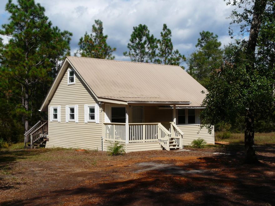 Wonderful home in the woods yet, 100 ft to paved road to town. Well maintained home or cabin for the people who need to getaway with all the comforts of home. Brand new AC & Heat Pump. Newer double pane windows, new Security System. Upstairs Family Room could also be another bedroom with a closet added. Appliances stay - Refrig 10 mo. old. Room to park all your toys, boat, trailer, etc. Only about 9 miles to town. Wonderful Front Porch to enjoy and Deck across back to barbecue and picnic. Peace and quiet in a fantastic setting.