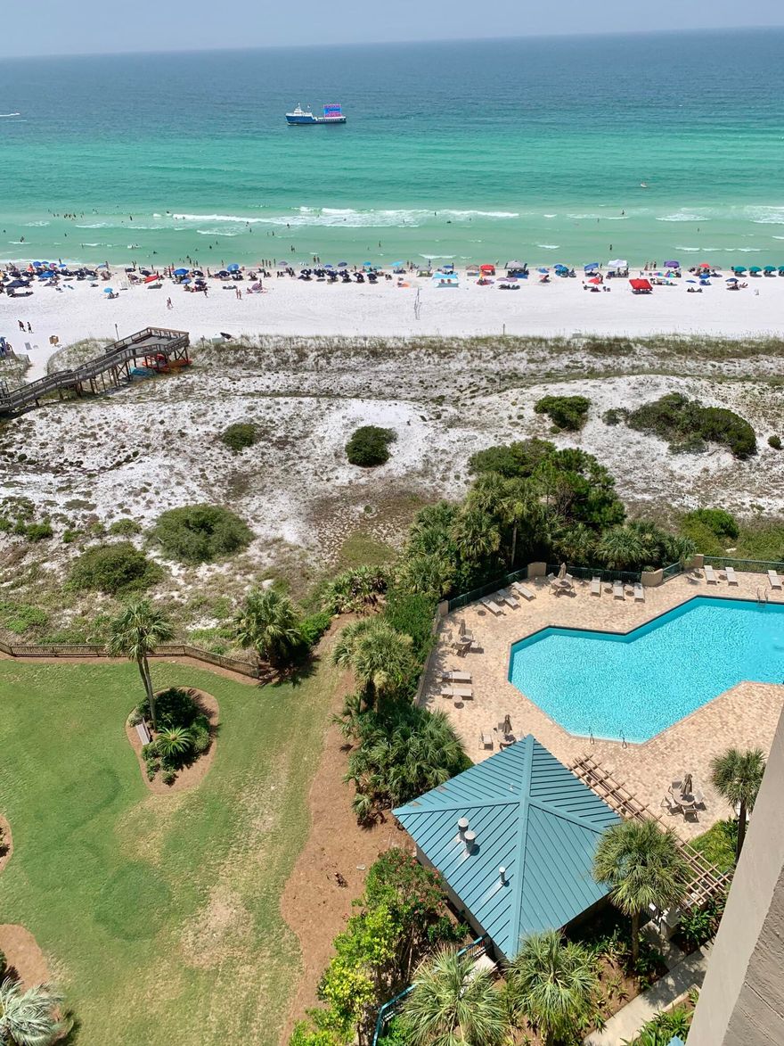 This 12th floor beautiful beachfront furnished condo has an abundance of light entering it from the 30 ft. of sliders facing the Gulf to the huge dining room window that sees the golf course and the bay. In addition to being rental-restricted, Southwinds features a private beach for the owners. The Master bedroom has sliders opening onto its private balcony and the king guest bedroom also has a balcony with views of the bay. The 3rd bedroom has bay views as well. The master bath has been updated with a frameless glass shower and quartz counter tops. It also has a window with a great view making the room feel bright and airy. The 2nd bath has been updated with quartz counter tops and a large tile back splash that surrounds the tub. The kitchen has been updated with stainless appliances.