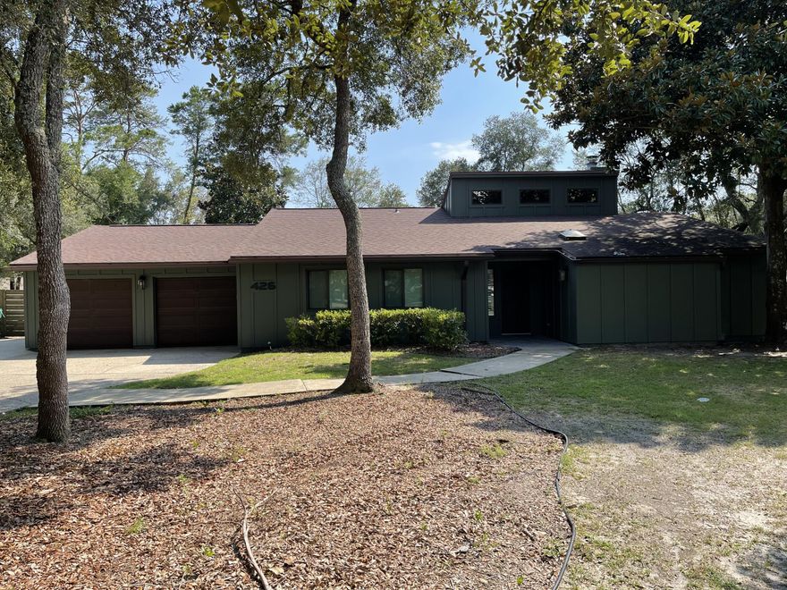 This home has had so many improvements to include freshly painted exterior, oversized paver patio in the backyard, all popcorn has been removed, NO Carpet!The home features hand scraped wood floors in the main living areas, vaulted ceilings in the large living room, a wood burning fireplace, plantation shutters in main living area and stainless steel appliances in the kitchen. The garage has a built in work area separate from the main garage and there is a storage shed in the back yard. Located in a cul-de-sac on a large lot with just under a half acre and a fully fenced in yard. This home is in Bluewater Bay near shopping with fantastic schools, convenient to Destin and Eglin AFB and walking distance to Schooners and the Marina.