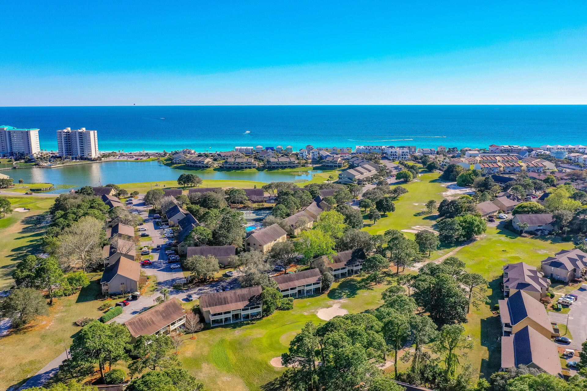 Experience luxury living in this top-floor, penthouse level condo w/ a private beach at your fingertips. Indulge in modern amenities and architectural character. Located in a gated community with 2,000 ft of private beach, this 1BR, 1BA condo in the tranquil Golf Villas at Seascape Resort offers hard flooring, vaulted ceilings with wood beams, and ample natural light. The kitchen features endless countertops and a custom backsplash. The charming balcony, complete with a swing and outdoor dining area, provides a perfect retreat. Steps from the private beach, enjoy 5 pools, an 18-hole golf course, tennis courts, and more on the expansive 500-acre property. Priced to sell fast, relax in style and soak in breathtaking nature views from the deluxe-sized private balcony. Your paradise awaits!