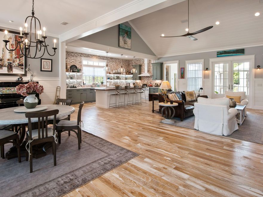 Nestled within a quiet cul de sac near the Santa Rosa Beach Golf Club, this elegantly designed and masterfully constructed Southern Craftsman home is the ultimate coastal retreat engineered for primary living. Immensely livable, the meticulously curated interior selections provide an expansive lifestyle experience, enhanced by the spacious lot and multiple living spaces. An open vaulted living space offers an entertainer's dream design integrating the french country-inspired kitchen, dining space, and great room, for a relaxing yet refined area of enjoyment. Four bedrooms in the main house craft elegantly appointed private spaces with extreme care dedicated to the tile and fixture selections in the oversized baths.
