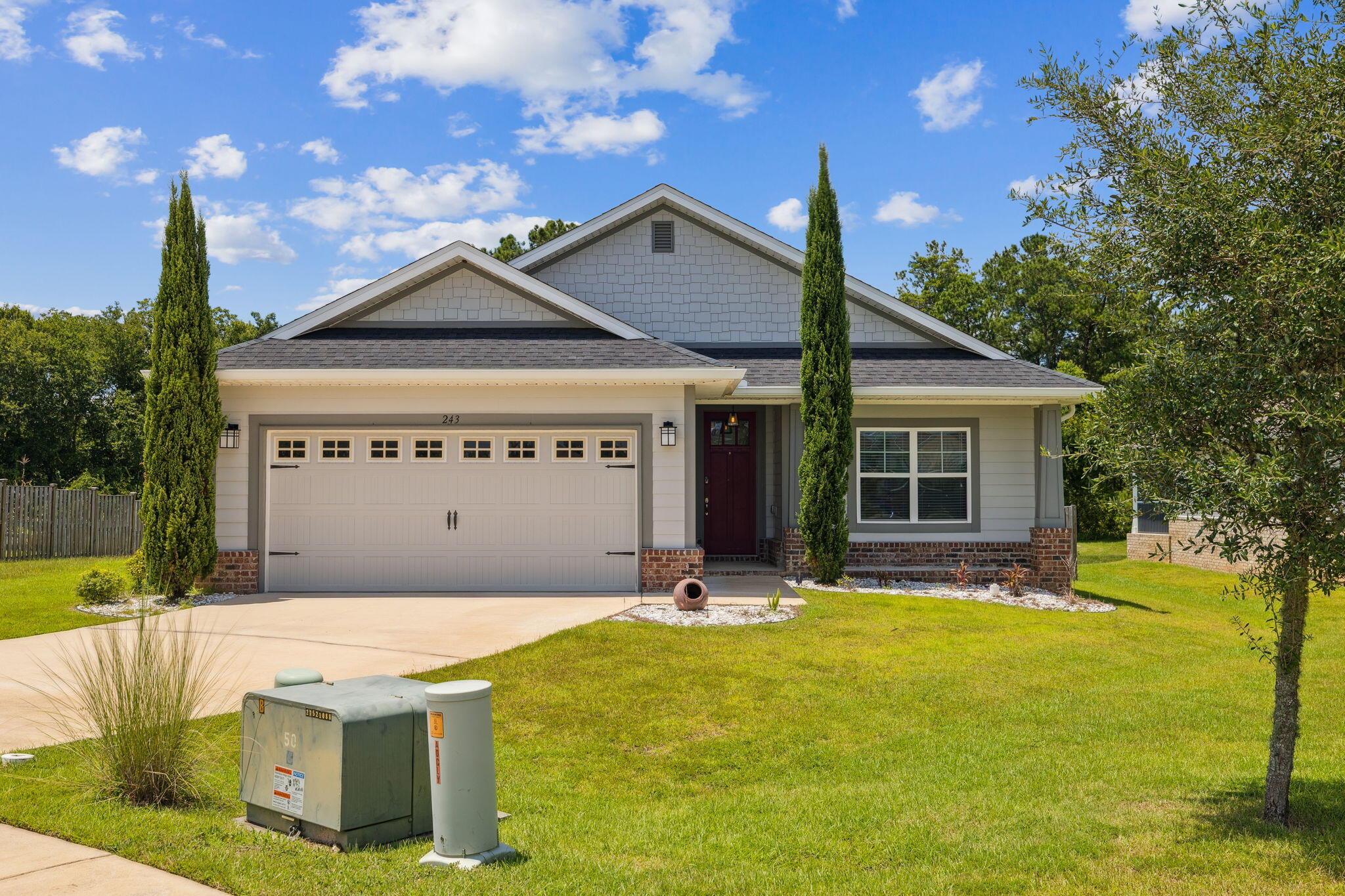 Gated Community! Move in ready! Prime location 13 Miles from the Blue Mountain Beach access! Less than 1 mile from the local Publix shopping center. Welcome to Lafayette Creek Landing! Bring your paddle boards and kayaks! Here is your opportunity to own a 2019 ''Adam's Homes'' build featuring three spacious bedrooms and two full bathrooms. Beautiful galley kitchen with lots of cabinet/counter space and breakfast bar. Stainless steel appliances. The primary bedroom boasts a 14X22 layout that can easily accommodate a King sized bed accompanied by a spacious en suite bathroom. Granite countertops throughout. Flooring in the home is finished with luxury vinyl plank while bedrooms are carpeted. High ceilings! Wood burning fireplace! Situated in the corner of Brandywine Road, this property features exclusive privacy not found in other lots. There is plenty of parking space with a two-car garage. At the back of the home you will also find a large screened in porch as well as a fenced in backyard perfect for outdoor living and entertaining. The property backs up to a wooded area and Lafayette Creek. Schedule your showing today!