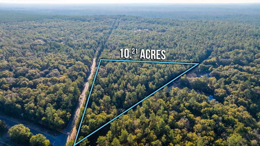 Discover the perfect place to put down roots on this spacious, dry homesite surrounded by that natural country setting. With mature trees offering shade and privacy, this land provides a peaceful backdrop for a custom-built home, porch sunsets, and wide-open space to enjoy the outdoors. Located on a paved road with utilities nearby, the property is easy to build on while still delivering the privacy and freedom country living is known for.  Enjoy the best of both worlds with quick access to the interstate while coming home to peace, quiet, and room to breathe. Many uses for the property, bring your horses/livestock, mobile home or start a farm or campsite!