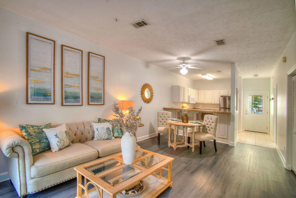 Get your dose of 30A all year long! This amazing ground floor condo in Seagrove Beach offers the 30A lifestyle at an affordable price. Head to the famous white sandy beaches, swim in the community pool, or take a golf cart ride to the Hub or Seaside. Enjoy deeded access to one of the area's rare coastal dune lakes, Eastern Lake, where you can paddle board or kayak to the Gulf! Heron's Watch is a gated community that is just minutes away from Old Florida Fish House, nature trails, shopping, & all that the East end of 30A has to offer. This unit features new LVP flooring in the bedrooms and living area, fresh paint, and has a newly refinished tub and counter in the master bathroom. The private patio backs up to forest views of Point Washington State Park and has a storage closet for all your