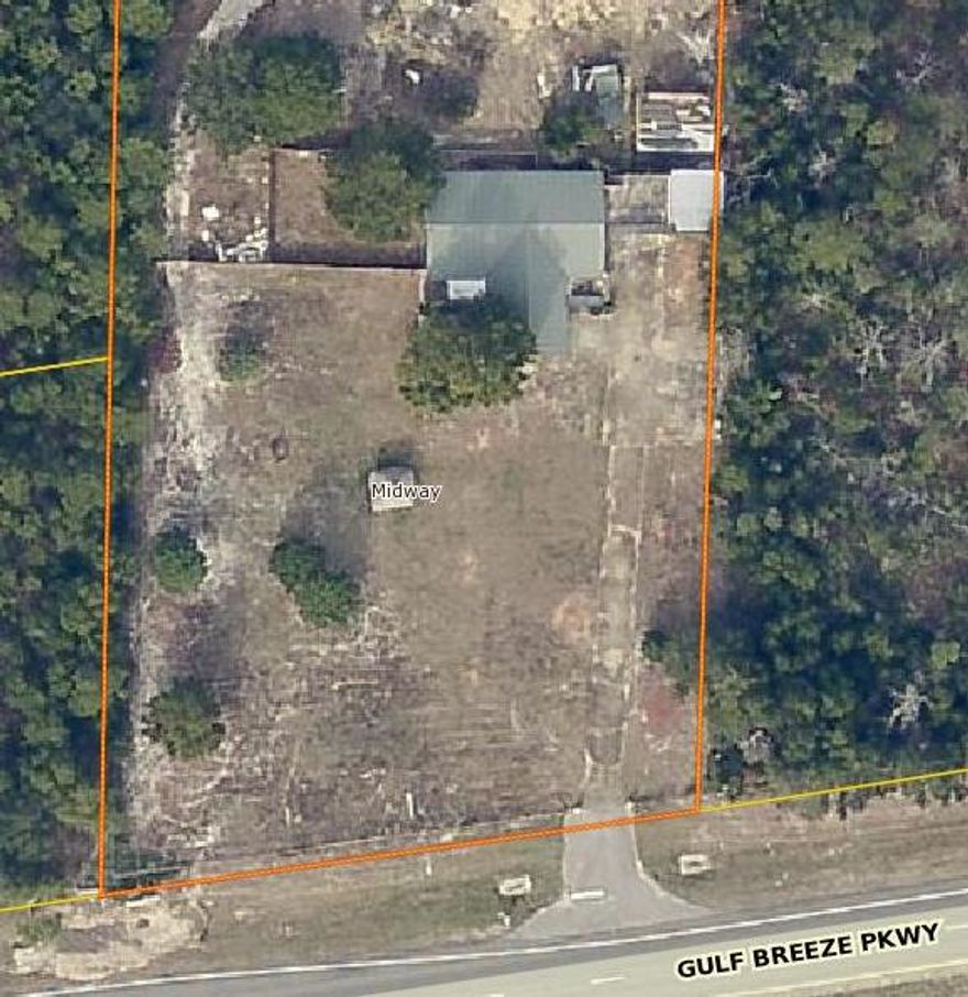 1.25 Acres(+/-) of Office/ Retail with 1800 sf of office and an additional 700 sf of warehouse/ garage space. The property has 200 front feet on Hyw 98, is fenced and Highly visible.