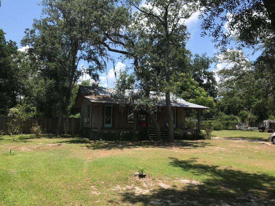 Fishing in your blood? Cute Florida cottage on 1/4 acre in Black Creek area with large oaks and lots of space. This fixer upper is 2 Bedroom/1 bath perfect for weekend getaway or first home. Close to fishing and boat launch. Very quiet neighborhood. There is an additional 1/4 acre to west of property that can be purchased.Great location to bay parks, beaches, shopping and new Publix in Freeport.