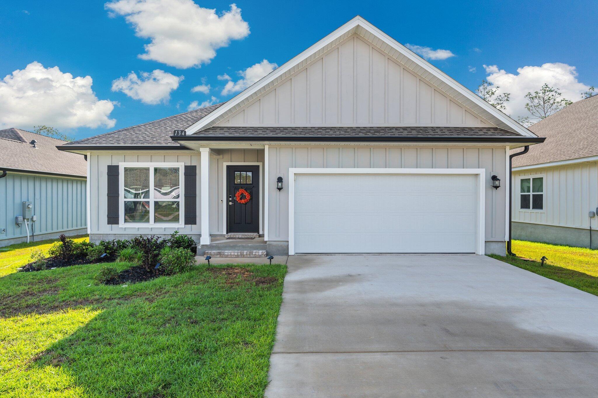 Welcome to Magnolia Creeks! This 4BR/3BA craftsman home offers 2,117 sq ft on a cul-de-sac with no rear neighbors. Features include 9' ceilings, quartz counters, SS appliances, island, upgraded cabinetry, and a large laundry room with washer/dryer. The primary suite has a garden tub, tiled shower, and custom closet. One guest room has an en-suite bath; two others share a hall bath. Garage offers attic storage, shop lights, shelving & more. Enjoy the covered patio, smart thermostat, security system, Wyze cameras, and termite bond. Move-in ready June 4! All Coastal Realty Services residents are enrolled in the Resident Benefits Package which includes renters insurance, HVAC air filter delivery, a rewards program, and more. Full details available upon application.