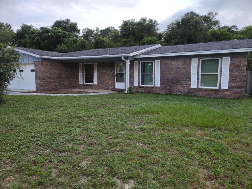 Investment opportunity. Property needs updating. Spacious lot. Screened porch.