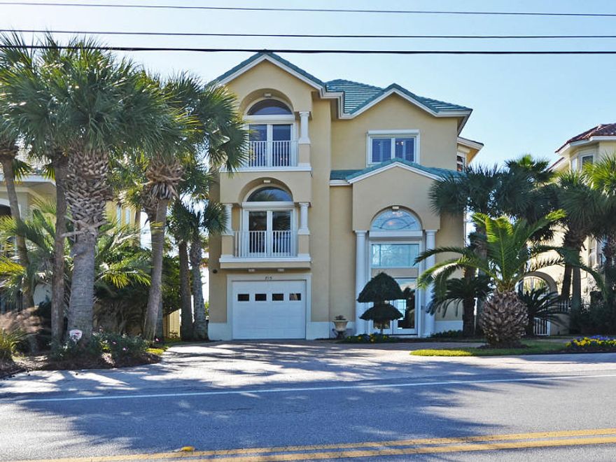 Experience gulf front living at its finest! This exquisite 3-story home is located directly on the beautiful emerald green waters of the Gulf of Mexico. This home features six bedrooms, six and a half baths and a separate lock out mother-in-law suite. Perfect for a personal residence, second home or a vacation/rental. Beautiful architectural features include, decorative crown molding, marble flooring, custom plantation shutters. The home has a total of 6,125 sq. ft. under roof with 4,058 sq. ft. heated/cooled space. All luxurious levels open to large balconies overlooking the beautiful Gulf of Mexico. All balconies are equipped with flat screen TVs, perfect for entertaining. All levels are easily accessible with your private elevator.