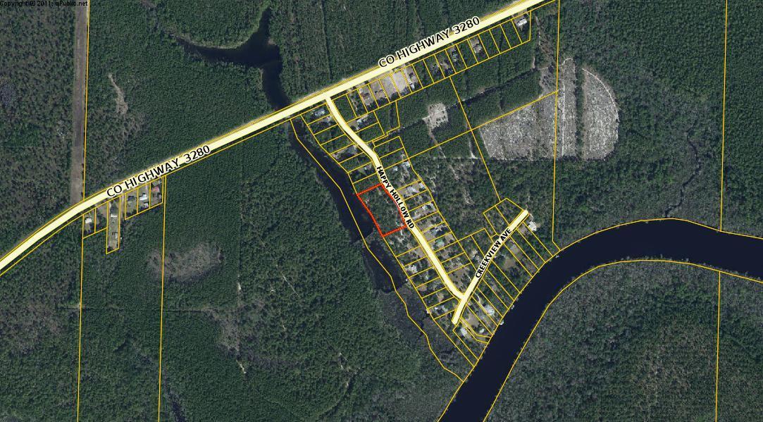 Happy Hollow is a well-kept secret! Conveniently located south of Hwy 20 and close to Hwy 331 for easy access to Hwy 98 and north to I-10. Well maintained Subdivision with no HOA and no dues! Wooded half-acre lot on the lake in Happy Hollow. There are four adjoining lots total for sale. Buy one, two, three or all four!! Water access for homeowners to Black Creek. Enjoy Florida living just north of the hustle and bustle of the vacation/resort areas. New Bayfront Park at the Choctawhatchee Bay Bridge under construction and open soon. New businesses locating in Freeport. Build you new home in Growing Freeport!