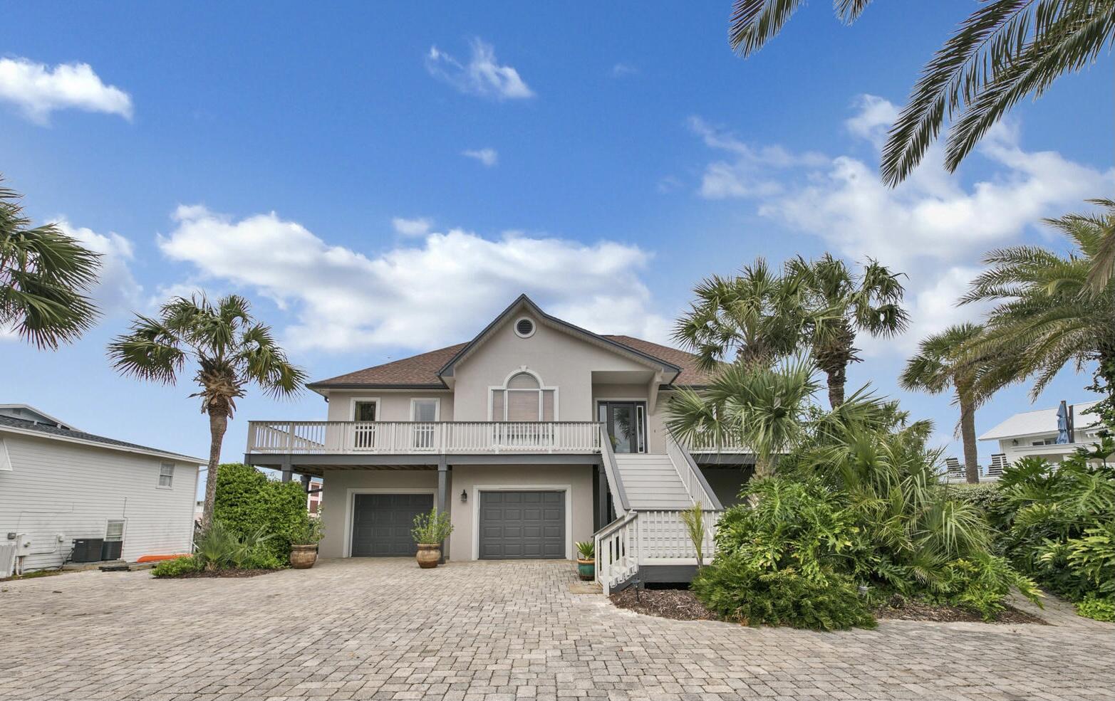 This beautiful home just one block from the private beaches of Holiday Isle. It is the perfect home for entertaining inside wlth the open living, kitchen areas on each level. Outdoor entertaining also with its pool, hot tub , outdoor kitchen, covered rear deck and 360 degrees of porches. Park your boat at the 90 ft dock on the deep water canal. This home also has a additional 5th bedroom that can be used for rental.
