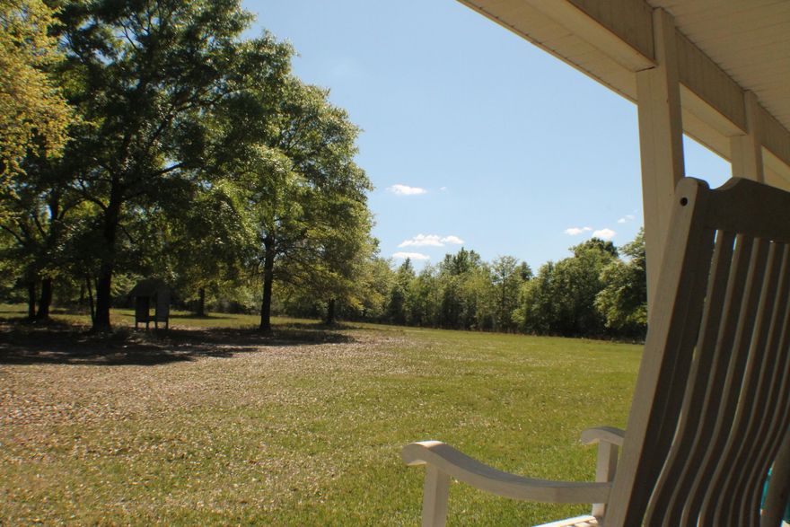 Come enjoy the country on 5.5 Acres while sitting on your porch with room for more rockers. Massive oak Cleared pastures huge barn close to town on a paved road! Watch the birds with your morning coffee! Quaint 3 bedroom 2 bath cottage in Baker with a huge pole barn and lots of space!