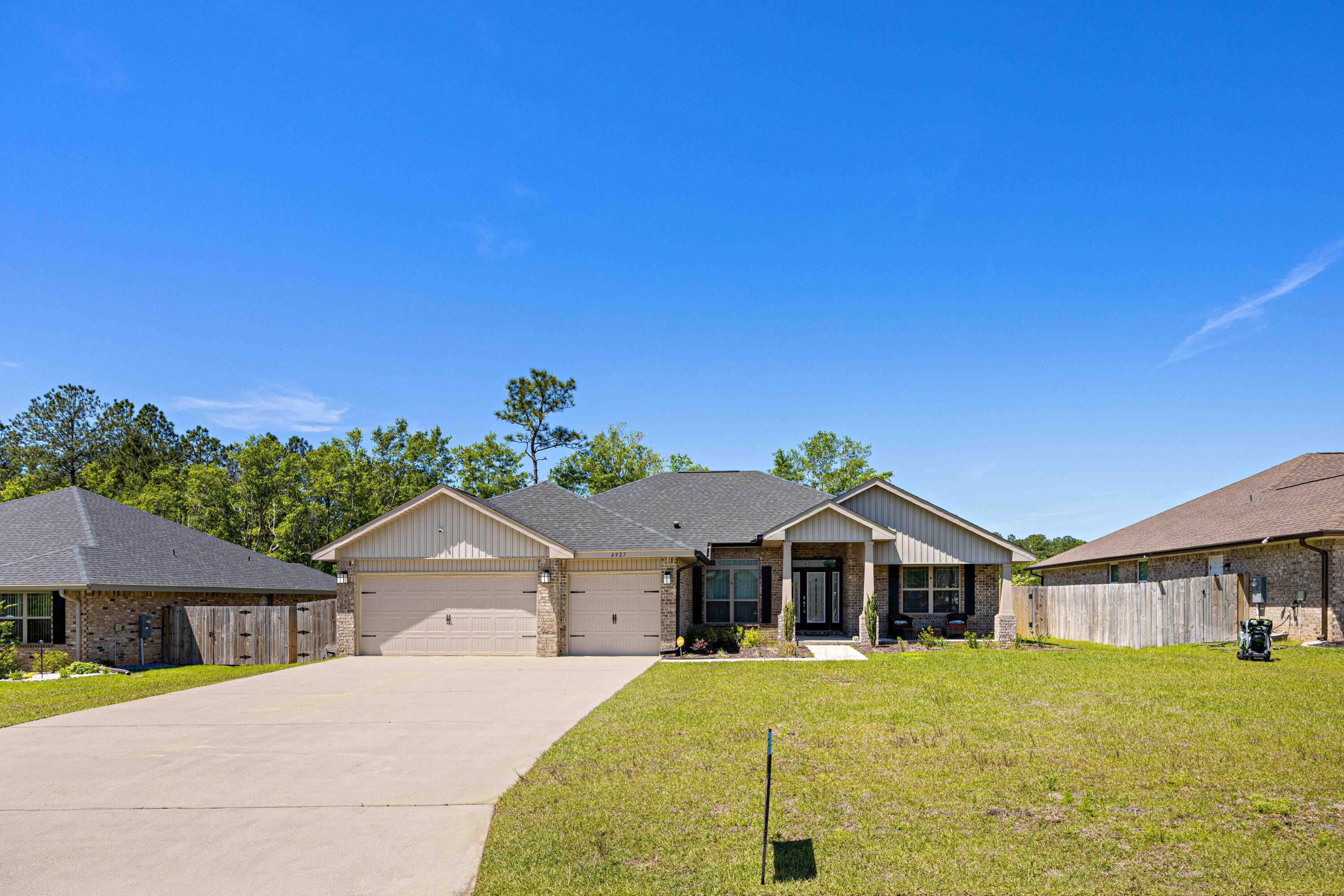 Welcome home! Come see this spacious craftsman style home in Hamilton Crossing. Featuring a split floor plan with 4 bedrooms and 3 full baths. The kitchen offers granite countertops, generous cabinet space, and stainless steel appliances. The primary bathroom includes double vanities, a separate shower, and a soaker tub to wind down in after a long day. Vinyl plank flooring in the main living areas and carpet in the bedrooms, which provides easy maintenance. The backyard is fenced with an irrigation system to help keep the yard green and beautiful. Come make this house your new home!