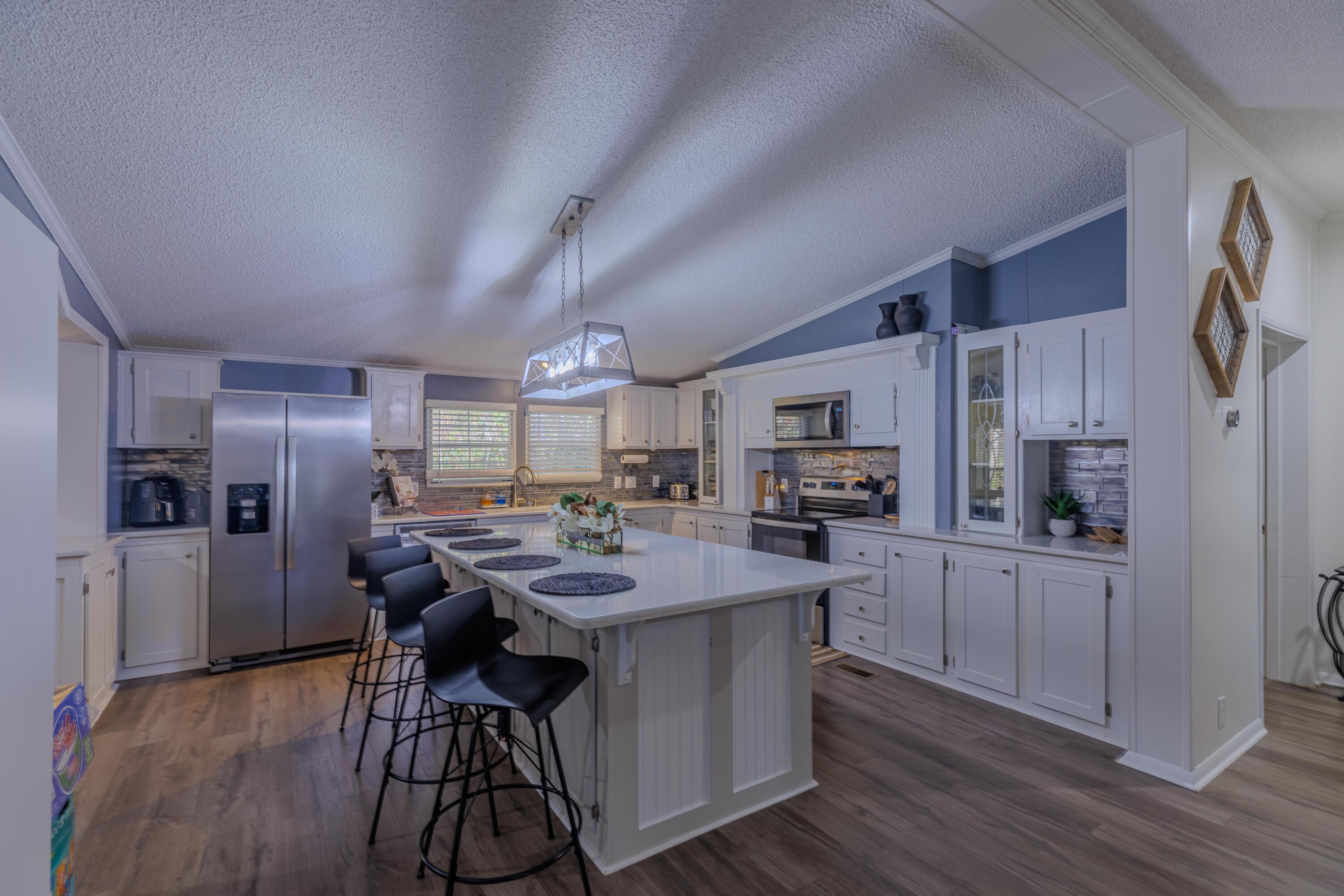 Move in ready. Minutes to the white sands and Emerald waters of Navarre Beach AND Quick commute to Hurlburt base. Central to Crestview, Gulf Breeze, Pensacola and Destin. Great location! Split floorplan! Quiet setting with wooded barrier to the North and East of the home. Private, quiet road with no through-traffic. Modern and beautifully neutral interior colors. NO PETS! Almost 2400 sq.ft. of living space. Spacious rooms. Extra large master bathroom. Open Living area features vaulted ceiling. Beautiful kitchen with breakfast bar and newer appliances that all remain with the home. Washer and Dryer are also included. Separate office space! Luxury vinyl plank floors. Large screened porch. New roof in 2022. New 2023 outdoor shed will also remain with the home upon sale.