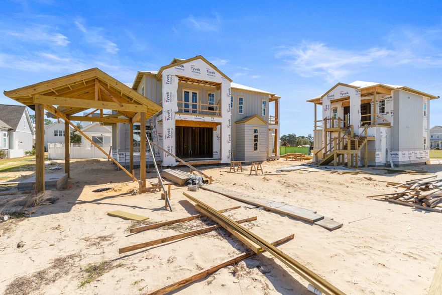 Crafted by Cole Construction, this newly envisioned retreat blends timeless architecture with modern livability. Featuring five bedrooms, five bathrooms, two half bathrooms in the main living area, and a detached one bedroom, one bathroom carriage house apartment above the expanded two car garage with designated area for a golf cart, this two-story coastal home offers over 4,300 square feet of conditioned living space.The inviting entry opens into an airy, open-concept layout where the chef's kitchen, dining, and living areas flow seamlessly together. The kitchen showcases professional-grade appliances, a generous breakfast counter, custom cabinetry, a 48-inch gas range with vent hood and pot filler, a farmhouse sink, and abundant natural light. A separate chef's pantry adds additional prep space, while the living room centers on a direct-vent gas fireplace with custom built-ins.

The primary suite provides a serene first-floor retreat, with a freestanding soaking tub, dual vanities, an oversized walk-in shower, a substantial custom-fitted closet, and direct access to the covered porch and pool terrace, creating an effortless indoor-outdoor connection. A second bedroom on the first floor serves as an ideal guest suite with its own private bath.

Upstairs, three guest suites each with private bath and walk-in closet, surround a generous loft lounge, offering flexible living for family or guests. Covered porches extend from multiple rooms, capturing breezes and peaceful neighborhood views.

The outdoor living area is designed for year-round enjoyment with a saltwater pool featuring a sun shelf and integrated spa, a built-in fire pit, and a brick pavilion housing a complete summer kitchen with grill, sink, and beverage refrigerator. An outdoor shower and cabana bath add convenience for poolside entertaining.

A detached carriage house apartment above the expanded garage offers a kitchen with full-size appliances, vaulted living area with built-in bookshelves and a separate bedroom with a full bathroom, creating the ideal space for extended guests or private office retreat.

Exterior details such as board-and-batten and nickel-gap siding, decorative wood brackets, and architectural corbels highlight the home's craftsmanship and coastal character.

From its thoughtful layout to its refined finishes, this new Cole Construction home embodies the effortless charm and enduring quality of Watersound Origins living.

Estimated Completion: Nov. 2026