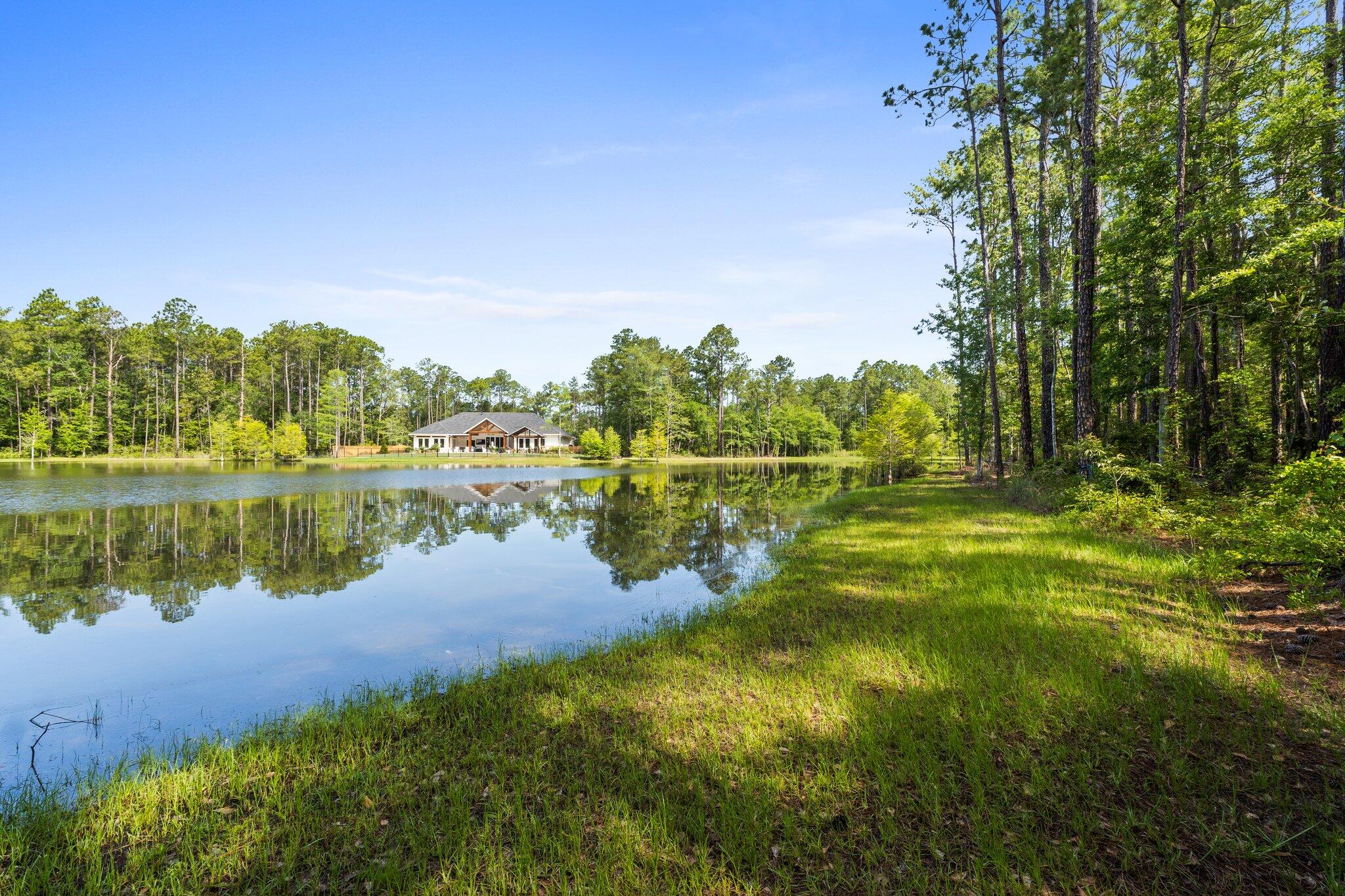 Discover the perfect canvas for your dream home on Lake Anastasia in Steamboat Landing at Hammock Bay! This expansive .79 acre lot enjoys approximately 100 feet of lakefront offering breathtaking views and tranquil surroundings. Nestled in gated Steamboat Landing, this parcel provides ample space for a custom-built residence, lush landscaping and all your outdoor amenities. Nature lovers and water enthusiasts alike will love Freeport's dry boat storage, deep water slips and the stunning beaches of 30A! Steamboat Landing residents have access to the Bayfront Clubhouse and all of Hammock Bay's amenities including three clubhouses, four swimming pools, brewery, etc. Don't miss this opportunity to own your dream home in one of Florida's fastest growing areas. Buyer to verify all information.