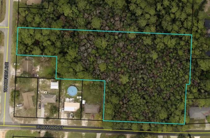 This 2.87 parcel consist of 4 lots (26,27,28 &34) with frontage on Wildwood St and Woodfern Ave.  It has been determined that the parcel includes .30 acres of uplands and 2.57 of wetlands that will require an environmental resource permit in order to build.  The parcels are currently zoned single family residential and there are no existing taps in place.