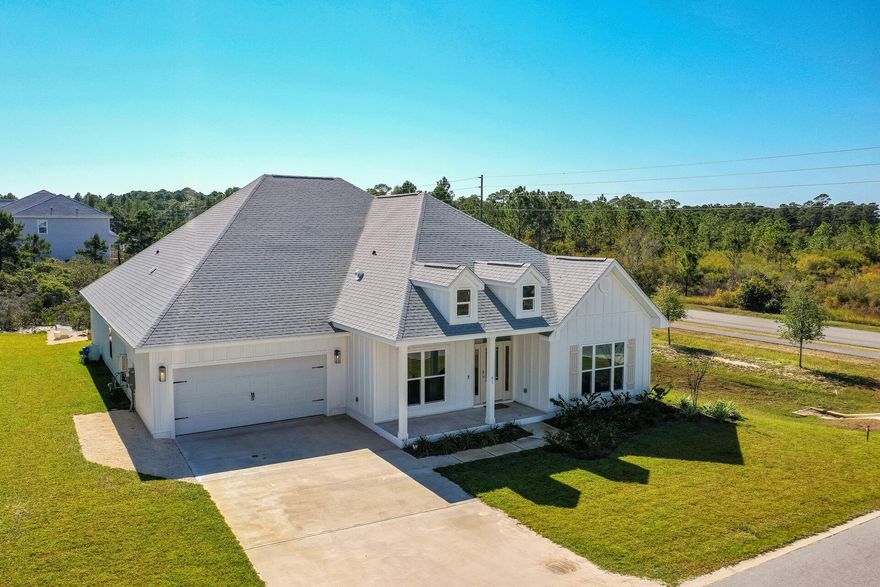 If you love the beach, adventure and relaxing, then you may have just found the perfect property for you. This immaculate home is located on the south side of 98 in the charming west end of Scenic Hwy 30A. The excellent positioning of this house offers many perks such as it is on one of the ideal lots in the neighborhood that backs onto green space! Also just a short stroll from some of the best food and fun the area has to offer, it is great to be able to walk, or take your golf cart back home for a quick break, nap, or to change for lunch at the popular town center Gulf Place! 

This recently built upgraded home has a family friendly floor plan featuring 5 bedrooms, 3 full bathrooms, and an abundance of extra living space just off the foyer. In the heart of the home you will find the chef's kitchen overlooking the living area with a beautiful coastal themed backsplash, walk-in pantry, farm sink, gas Kitchen Aid cooktop, ample counter and cabinet space and a large quartz center island where everyone can gather to cook, work or relax. The entertainment flow does not stop there. The covered back porch is a lovely spacious area to enjoy cookouts, the quiet nature and watch the most beautiful pink, purple and orange sunsets you will ever see! This is beach living at it's best.