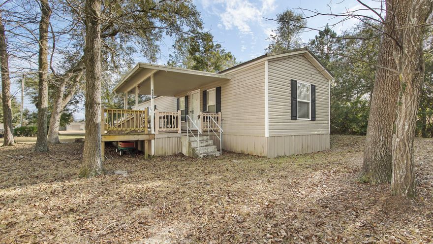 Perfect buy in Black Creek Freeport this LIKE NEW 2 BR - 2 BA manufactured home is just 1 block off Black Creek and allows easy access to the public boat landing located one street over. This home has been well maintained and is move in ready. Home offers a large kitchen with tons of cabinets, a great master bedroom with a master bath that includes tons of storage. Kitchen also includes access to a back open porch, includes the laundry room and dining area.  Living room gives you plenty of space and the home offers a split plan with an additional BR and full BA. Property is perfect if you are looking for your first home, vacation home to fish then run down to the beach and back, or as a rental. Home includes a large covered front porch also. Home has been moved and not able to financed.