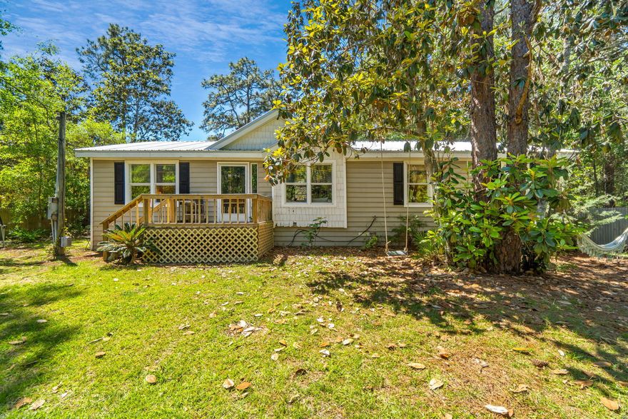 Take a look at this opportunity for some privacy, right in the middle of Santa Rosa Beach. This 4 Bd / 2 Ba home features a  split bedroom floor plan just minutes to the beach, shopping, Sandestin, 30A & 1/2 mile to Choctawhatchee Bay. This home sits on a large lot and allows plenty of space for outdoor activities. Laminate wood floors adorn the living area. The open kitchen, dining room and living room, are perfect for lounging or entertaining with family and guest. You will find ample margins in the master bedroom, to include an en-suite bathroom, with garden tub and stand up shower. The split floorplan also allows for master bedroom privacy, and gives guest and family their own space, opposite side of house, with bathroom shared in hall. A great find, in a great location!