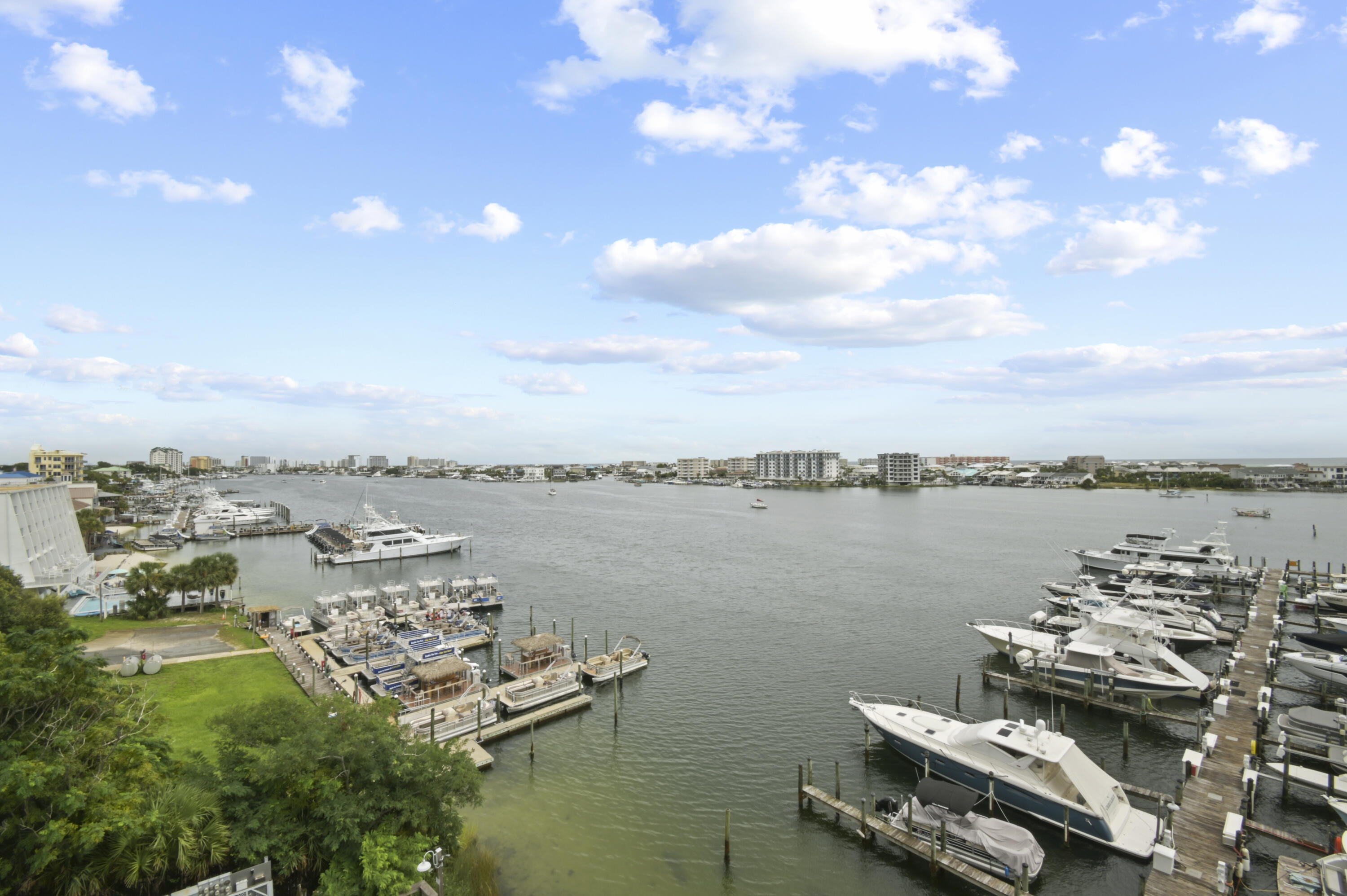Gorgeous views of the harbor/gulf from this 5th floor Destin Yacht Club condo. Units in this coveted community located directly on Harbor Walk don't come on the market often. This 2-bed condo has travertine floors throughout, a custom kitchen, a breathtaking master suite, a bunkroom, a storage unit and a balcony overlooking the east side of Destin Harbor. Community amenities include, a luxurious pool & gym overlooking the harbor, fire pit, boat slips, gated entrance, on site manager, and a kitchen, dining, bar area. This community is right at the start of Harbor Walk making it a prime location for everything Destin has to offer. The Windows, balcony doors and roof were replaced within the last 3 years. Although this condo does not have a deeded boat slip, they do become available for sale or lease. This condo will not last long so schedule your showing today!
