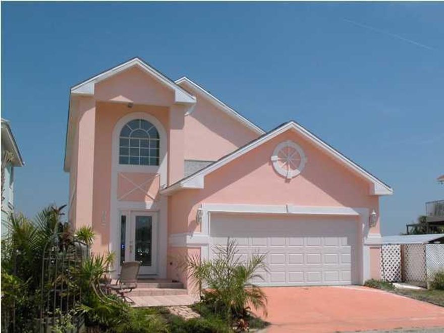 Stunning 180 degrees waterfront views on the beautiful Garnier's Bayou. An amazing price for a well kept waterfront home.Flood Insurance is only $410 per year. You will be delighted upon entering the beautiful foyer with a leaded glass door, & lovely staircase. The open floor plan of the dining room, living room, and kitchen offer water views to all. The light and bright kitchen with beautiful solid surface counters, boasts plenty of cabinets, upgraded appliances, recessed lighting and great views. This open concept 1st floor leads you to your large deck, dock and bayou views, making it perfect for entertaining, or just enjoying your piece of paradise. Just imagine upon preparing a wonderful meal, and with a moments notice jump on your boat that you'll keep in one of