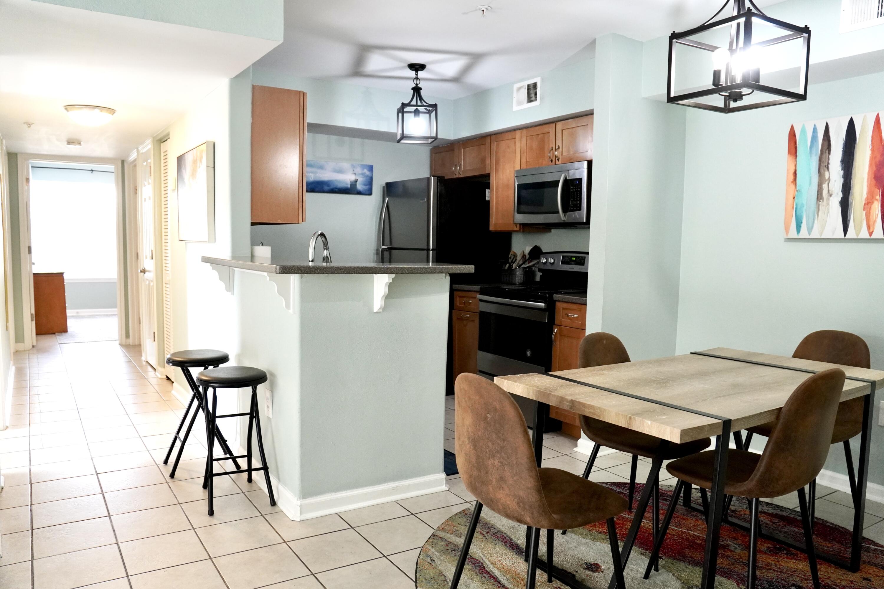 Welcome to 4075 Dancing Cloud Court, Unit 200, in the picturesque city of Destin, FL! This exquisite 3-bedroom, 2-bathroom condo offers over 1,200 sq ft of contemporary living space, ideal for those seeking a lease at $2,200 per month. Located on the ground floor, this property is perfect for anyone looking for comfort and convenience. Each bedroom is equipped with smart TVs, and there's a dedicated desk area for remote work. The condo features two queen bedrooms, one with direct bathroom access, enhancing privacy and ease. The master suite, with its king bed and en-suite bathroom, serves as a luxurious retreat.Step out to your private turfed patio, designed for relaxation under the Florida sun. With its prime location and modern amenities, this condo is tailored to exceed your expectations. Don't miss this opportunity to live in one of Destin's most desirable areas.