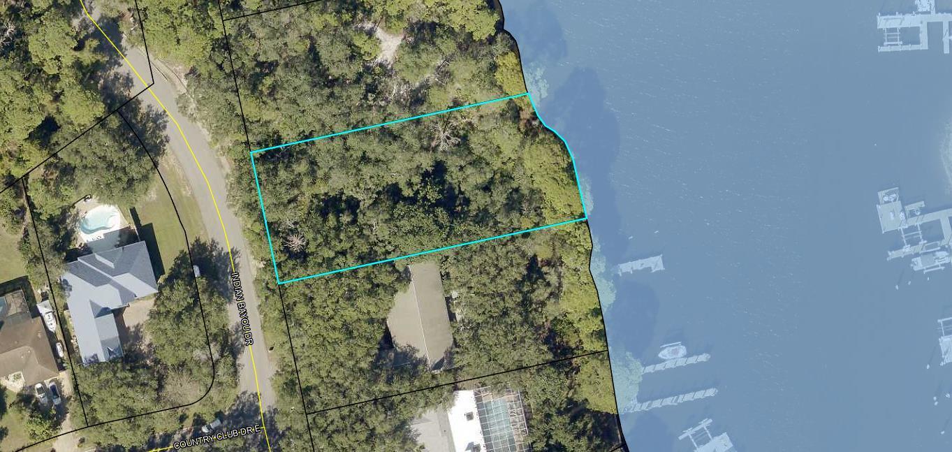 come tour this Beautiful deep water lot in the exclusive Indian Bayou Country Club and you will find a very peaceful and quiet lifestyle awaiting. this unique undisturbed Gem offers the rare opportunity to enjoy the boating lifestyle while being close to all of the shopping, dining, golf and entertainment that Destin has to offer. waterfront lots in Destin are rare and deeper water waterfront is even more so.. don't miss this opportunity to own and develop your unique and custom home. setbacks are 50' from the front, rear is 160 from the front and side setback is 10'.. homes must be a minimum of 2200 square feet with the ground floor minimum at 1800 SF.