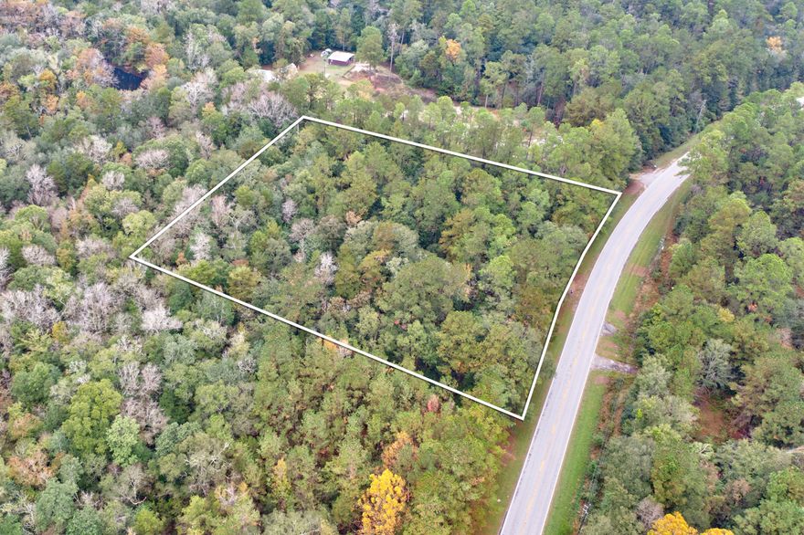 A serene 2.43 - acre property tucked away in nature yet close to conveniences, complete with  essential utilities (power, water, and septic) and a small existing structure. This setup could serve as an immediate base for outdoor activities and offers the enticing possibility of developing a cozy ''cabin in the woods''The structure provides a foundation, while the land invites creativity - imagine a warm, rustic cabin surrounded by trees, a garden and space for trails. A tranquil retreat and/or great space for a vacation investment property!! Want to get away amongst the trees, this your place!