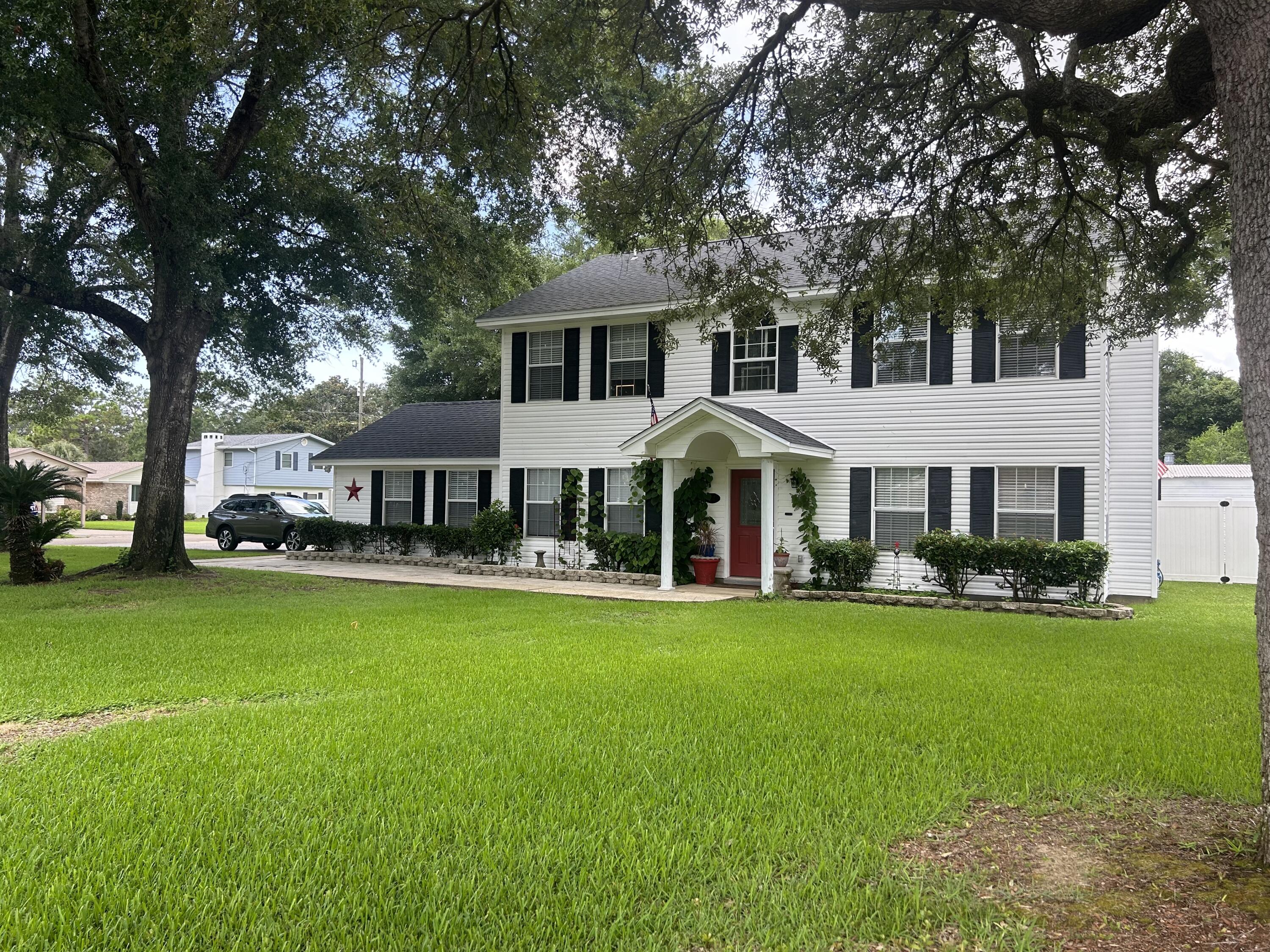 This grand Colonial home (4yr old roof) offers an impeccable living experience just moments from the pristine sands of the beach. With a spacious and light-filled layout spanning two levels, it provides ample room for entertaining. The open-concept kitchen, living, and dining areas flow seamlessly to the backyard, offering picturesque views of the pool. A separate lounge room, warmed by a fireplace.Outside, enjoy a sparkling in-ground pool for summer fun and a fire pit area perfect for cozy winter nights. Mature trees offer privacy, and low-maintenance gardens ensure more leisure time in your new home. Conveniently located within the Kenwood subdivision, this move-in-ready home is just moments from the beac & Eglin Air Force Base and Hurlburt Field. Excellent schools, shopping, and dining options are also nearby.