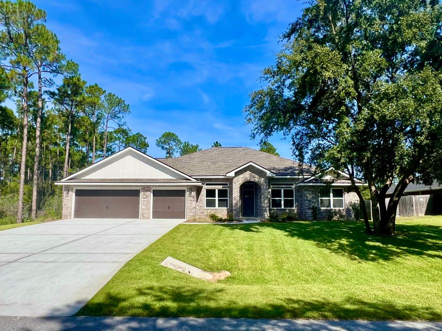 MOVE IN READY ,Close and enjoy your new home in time for the holidays. NEW Custom Built Home in Holley By The Sea,Enjoying all the Club House amenities including :Pools,Fully Equipped Gym,Tennis Courts,Waterfront Park & Deeded Access to Santa Rosa Sound This luxurious 4 bed/3 bath Tri split floor plan ~Great Location within HBTS..with easy access to Navarre Beach, shopping and Hwy 98 to Hurlburt Field AFB.This Stunning Robbins Builders Custom Home offers trend setting design & features~Greeted by the entrance foyer open to the Formal Dining and Office through to your open floor plan ~Large Gourmet kitchen enjoying shaker cabinets with crown molding ~ beautiful quartz counter tops~tiled back splash~under mount sink~S/S Appliances~Large wrap around deep pantry ~Center Island with open flow to the breakfast nook and family room, Wood Plank staggered tile through the foyer,dining room, main living area, laundry and bathrooms. Large Master with trey ceiling & ceiling fan. Master bath offers a large tiled shower /separate soaking tub~Quartz double vanity with picture frame mirrors & deep closet.Two additional bedrooms are a great size with double closets~ ceiling fans and share a bathroom with a tub/shower combo ,linen closet and WC.Third additional bedroom is separate from the other rooms and would make a perfect guest/teen suite with its own bathroom and access out to the large covered porch.Laundry room & over sized 3 car garage ...ideal for the larger trucks and still plenty of room for all the outdoor toys. Home is situated on a 10 x 200 lot with grassed yard ~sprinkler system~ lawn pump and well with digital programmable timer for easy care. TAEXX in wall pest control system~ Fabric Shield Hurricane protection and dimensional shingle roof for lower insurance premium. Upgrades include crown molding, recessed lighting ,framed mirrors, deluxe lighting package,50 Gallon water heater, garage door remotes, attic drop down stairs~ to name a few......Call today for further information ,colors and construction status.** pictures are of previously closed homes so colors ,fixtures and finishes may vary .