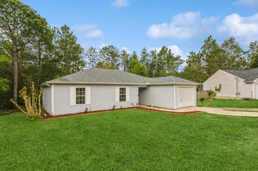 Come on in and discover your very own slice of paradise! This magnificent South Crestview home is an absolute gem, perfect for creating lasting memories. With its convenient location min. from 7th Special Forces Group, Eglin Air Force Base, and bustling shopping centers, you'll have everything you need right at your fingertips. Situated on a generous 0.90-acre lot, complete with a charming pond, this property offers a tranquil escape from the daily grind. Step inside and be amazed by the brand new LVP flooring that adds a touch of modern elegance to every room. The recently renovated bathrooms boast stunning tile floors, providing a luxurious retreat. Plus, enjoy the added benefit of lower county taxes! Don't miss out on this incredible opportunity to make this house your forever home