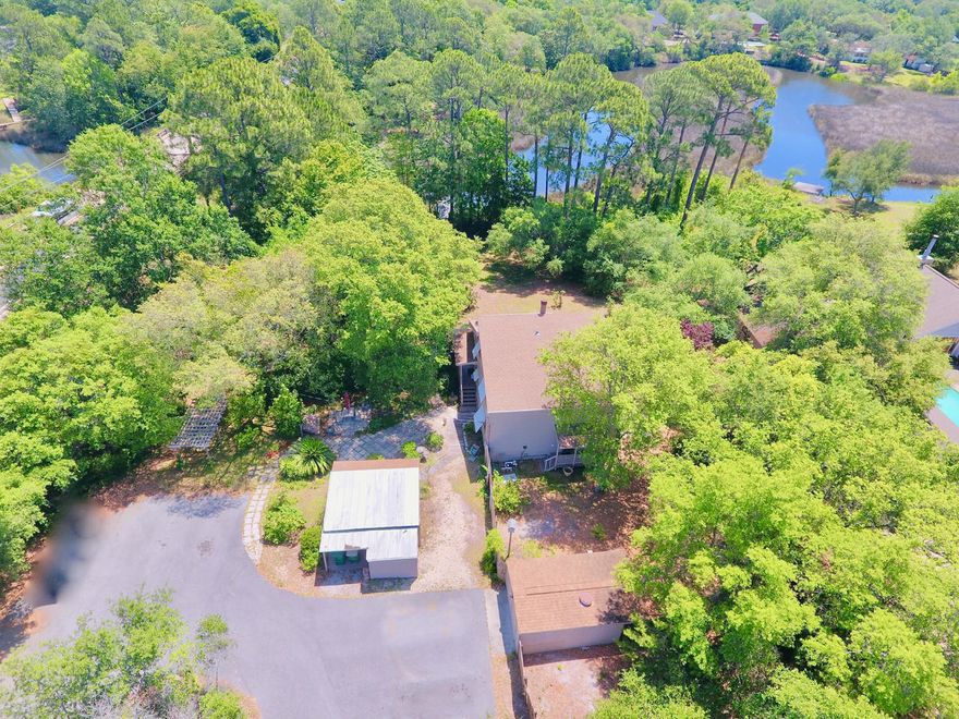 Enjoy the great outdoors with this beautiful property with over an acre of land on the bayou. Easily access Eastbay via your own dock. The yard is lush with mature landscaping with oak, fruit, and citrus trees with a garden and sitting areas. This home is My Florida Safe Home certified and has hurricane shutters throughout. Interior features include, venetian plaster walls in the living room and kitchen. The updates in the kitchen include tiled floors and backsplash, new countertops, halogen lights, bountiful cabinet space, and breakfast bar. The master bedroom is on the main level, and the master bathroom has been recently updated with a jetted tub, tile flooring, vanities and separate walk in shower. The exterior boasts fresh paint and there are two storage sheds with workshops