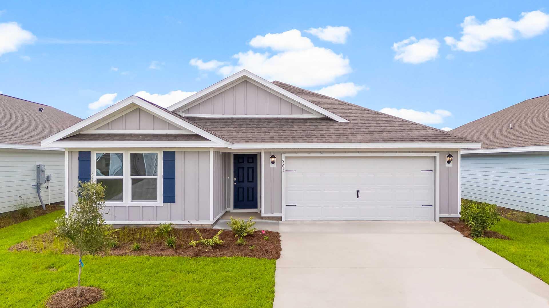 Welcome to 203 W Gray Owl Drive, a new home at Owl's Head Farms in Freeport, Florida. As you step inside this move in ready home, you find an open foyer that seamlessly transitions into a spacious living area filled with natural light. To your left, a modern kitchen showcases granite countertops, a large island with space for seating, and stainless-steel appliances. White shaker style cabinets add to the light and airy feeling of the home. A dedicated water filtration faucet at the kitchen sink is an added feature to this thoughtfully designed home. The dining area, positioned conveniently near the kitchen, offers a cozy space for meals. There are views of the backyard and patio through a glass door off the living room The laundry room is conveniently located in the center of the home. The main areas of the home have Engineered Vinyl Plank flooring in a light, neutral color.
At the rear of the home, the primary bedroom impresses with its generous size. The en-suite bathroom features a double vanity, walk-in shower, and a spacious walk-in closet and linen closet. Two sets of two bedrooms are strategically placed for privacy, each with ample closet space and easy access to shared full bathrooms for a total of five bedrooms and three full bathrooms. All bedrooms feature upgraded carpet.