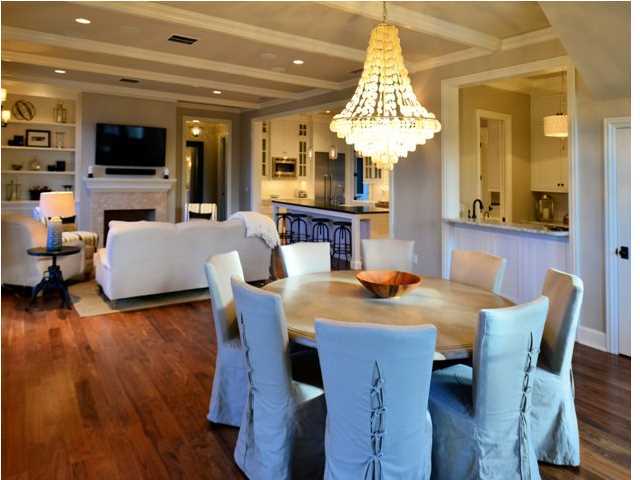 PROFESSIONALLY DECORATED AND MOVE IN READY! Located on a rare oversized homesite in WaterSound Beach this custom home is truly magnificent. Fronting Yacht Pond, this residence has the privacy and space that puts it in a category all its own and must be seen to be appreciated. Functional elegance greets you with the expansive living and dining areas which front the pond. There is wonderful natural lighting coming through the many windows in the living and dining area. A chef's dream kitchen awaits with large island, Thermador appliances, large pantry and a wet bar complete with wine fridge, icemaker and beverage center. The first floor also includes an enormous master ensuite complete with study, spacious walk-in closet and built-in cabinetry throughout. The master bath includes a