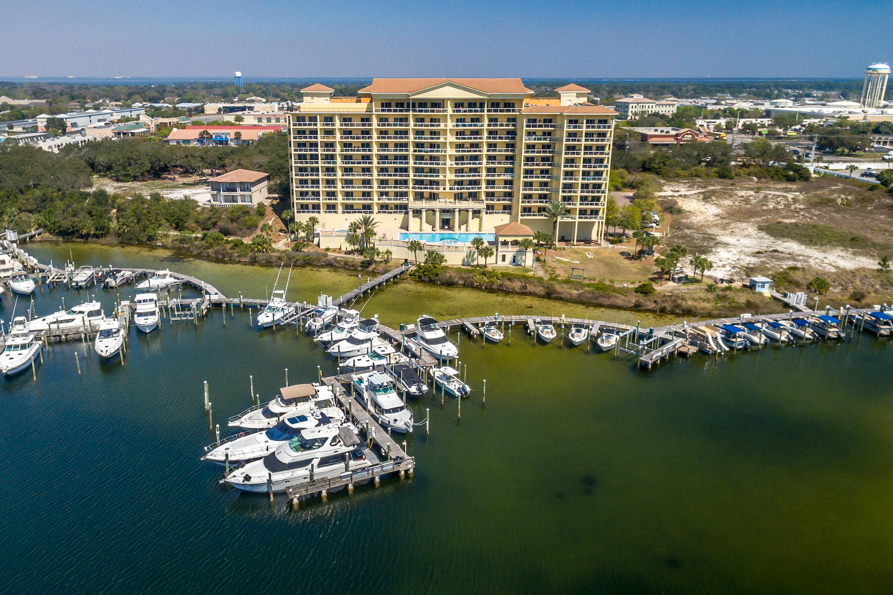 Welcome to the epitome of coastal luxury at Marbella Condominiums, located in the heart of Destin off Highway 98. This waterfront oasis offers an unparalleled lifestyle of sophistication, perched on a 35-foot bluff with panoramic views of Destin Harbor. Step into this impeccably updated 3-bedroom, 3-bathroom unit, complete with a versatile media room, seamlessly blending contemporary design with coastal elegance.Inside, wood-look LVP flooring sets the stage, leading to a kitchen and bathrooms adorned with quartz countertops and state-of-the-art stainless steel appliances. With new AC, water heater, and chic furnishings, this residence seamlessly combines modern comfort with coastal charm.Relish in the breathtaking vistas from your expansive private balcony, offering sweeping views of the marina, Gulf of Mexico, and vibrant Destin Harbor. Practicality meets convenience with two underground assigned parking spaces and additional storage.
Indulge in the array of amenities at Marbella Condominiums, including a professionally managed marina, a fully-equipped fitness center, a clubhouse for social gatherings, and a refreshing swimming pool. Unwind in the inviting hot tub by the pool, adding a touch of luxury to your relaxation.
This exceptional condo also presents the unique opportunity to own Boat Slip C-18 for an additional $200,000, providing direct access to the water for your boating adventures.
Discover the pinnacle of waterfront living in Destin, Florida, where every detail is meticulously curated to enhance your coastal lifestyle. Schedule a viewing today to experience the allure of Marbella Condominiums and make this coastal sanctuary your home. Embrace the essence of Gulf Coast living, where luxury meets relaxation, and every moment is an opportunity to savor the beauty that surrounds you.