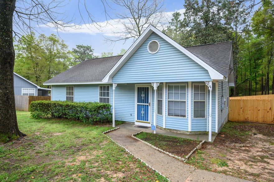 FRAME THIS ADDRESS! Picturesque 3 bedroom pleases the heart with its charming features like laminate flooring, open living/kitchen area, updated vanities in the bathrooms, walk-in closet in the master bedroom, privacy fenced yard and large deck for family BBQ's or relaxing with a large glass of tea.  An adorable find in the county (lower taxes)! Give us a call to see this one!